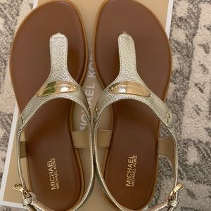 MK Plate Gold Flat Thong Sandal